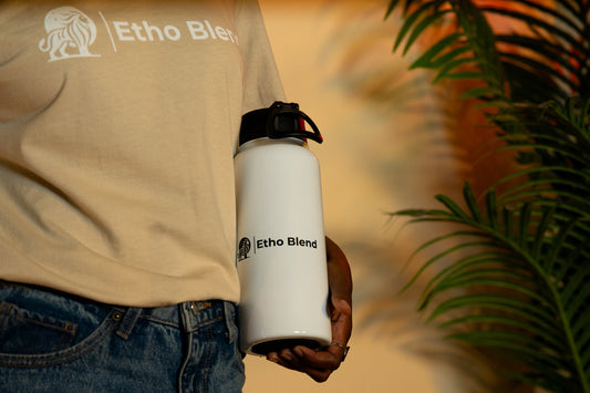Stainless steel water bottle with a straw lid